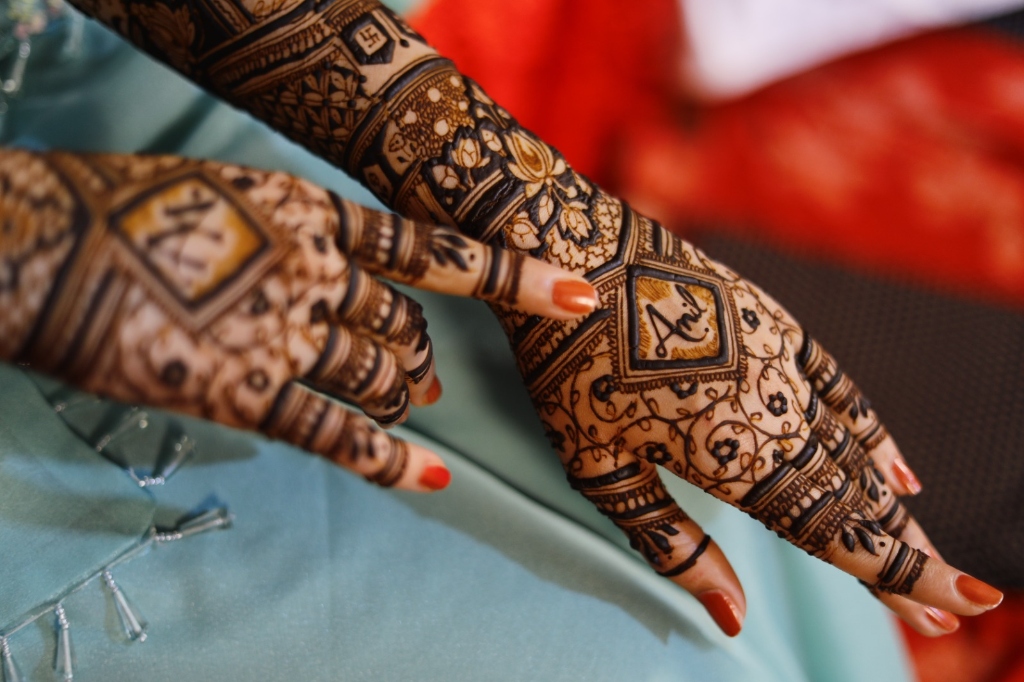 Full arm bridal mehndi with Rajasthani couple motifs