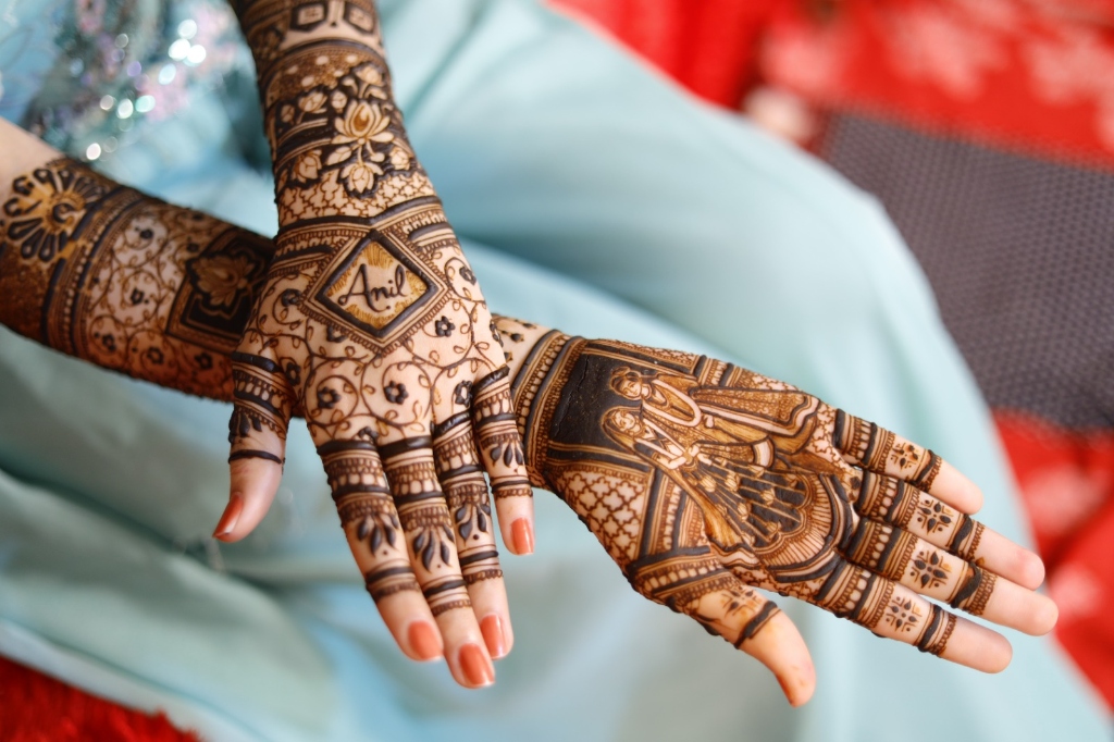 Close-up bridal mehndi with personalized name art